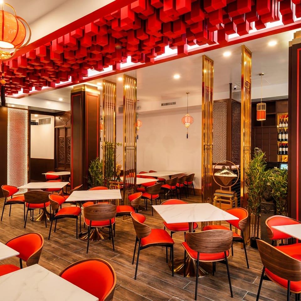 A vibrant restaurant interior with red chairs, white tables, and ornate red lanterns hanging from the ceiling.